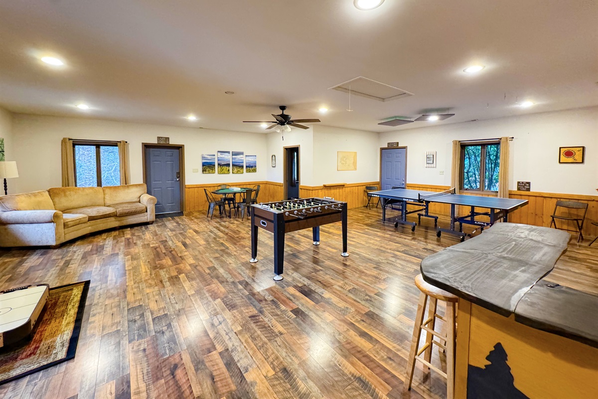 Our game room features foosball, ping pong table, ring toss, card table, kids's air hockey(floor model), Smart TV, kitchenette, bathroom, sauna, and more.