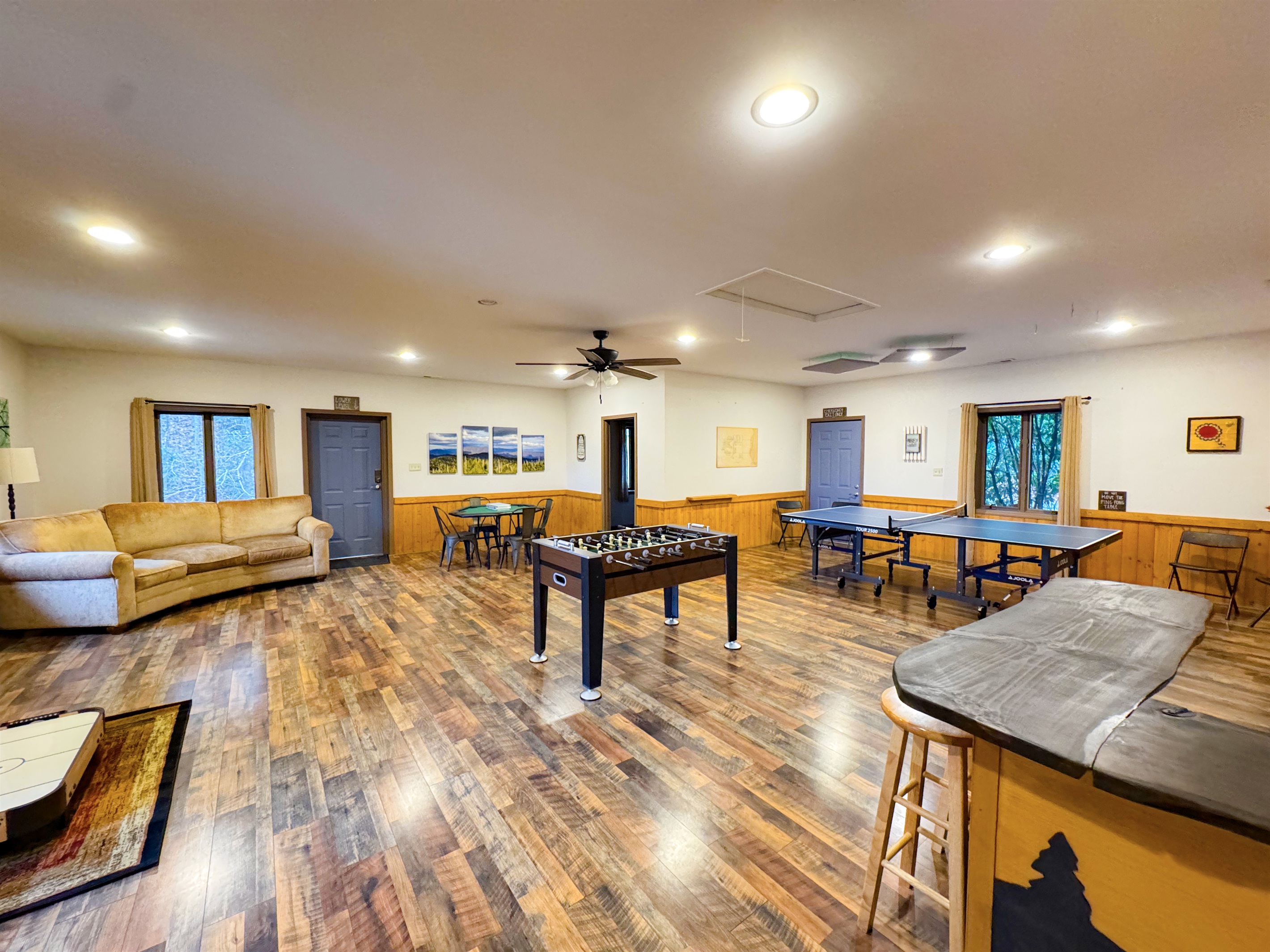 Our game room features foosball, ping pong table, ring toss, card table, kids's air hockey(floor model), Smart TV, kitchenette, bathroom, sauna, and more.