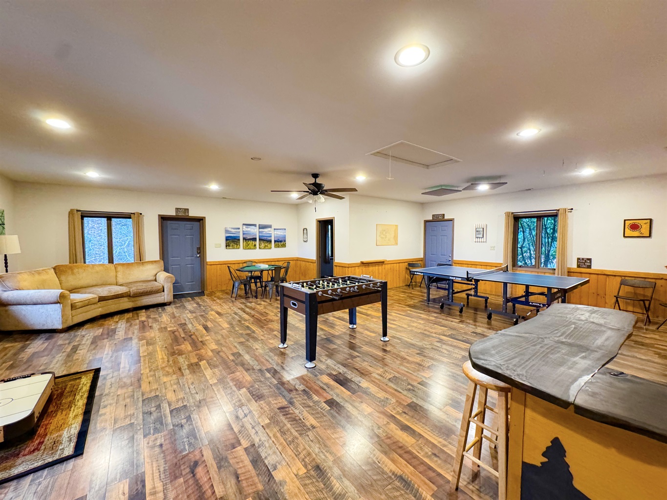 Our game room features foosball, ping pong table, ring toss, card table, kids's air hockey(floor model), Smart TV, kitchenette, bathroom, sauna, and more.