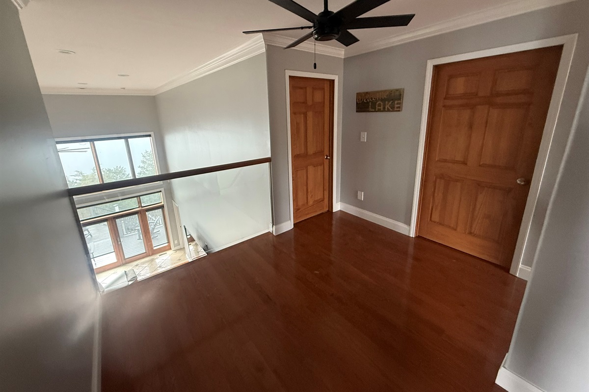 Upstairs hallway with a view down to the living room