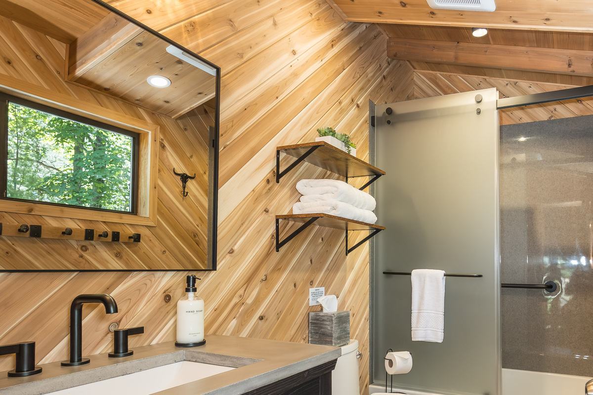 Second full bathroom with bathtub and shower combination.