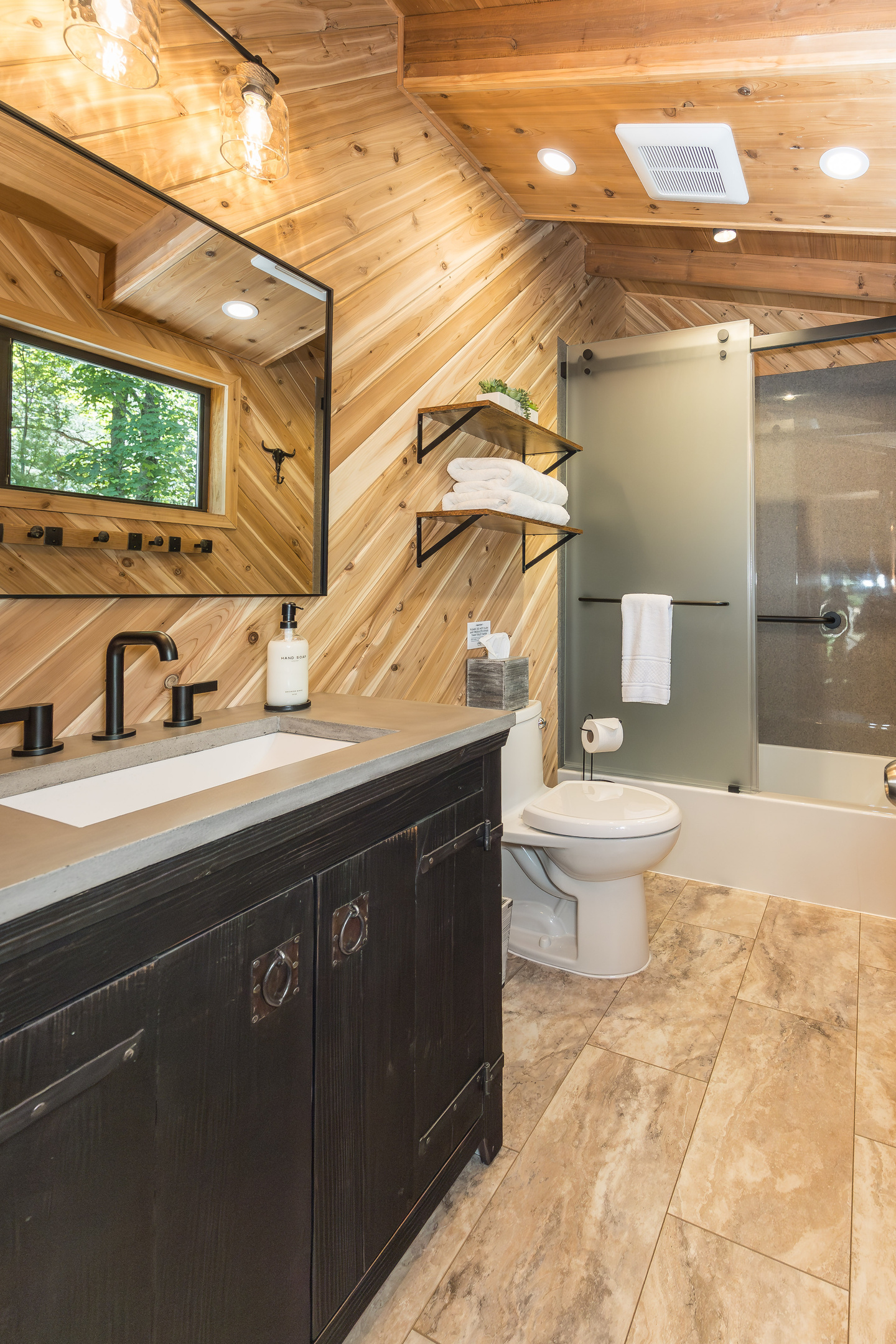 Second full bathroom with bathtub and shower combination.