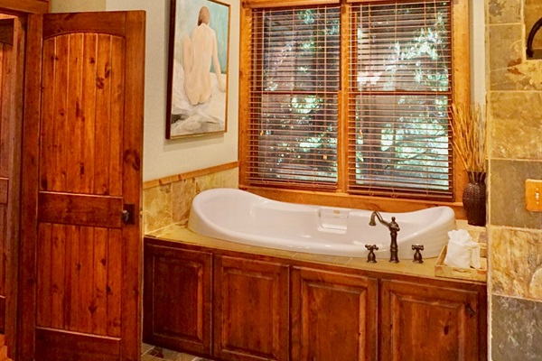 Soak away your stress in this serene bathroom retreat.