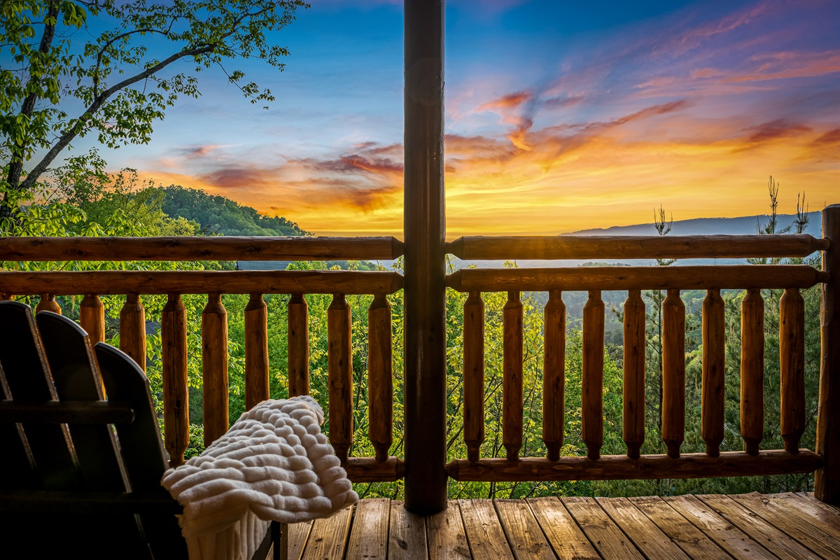Cozy porch seating with breathtaking mountain views—perfect for morning coffee or sunset relaxation.