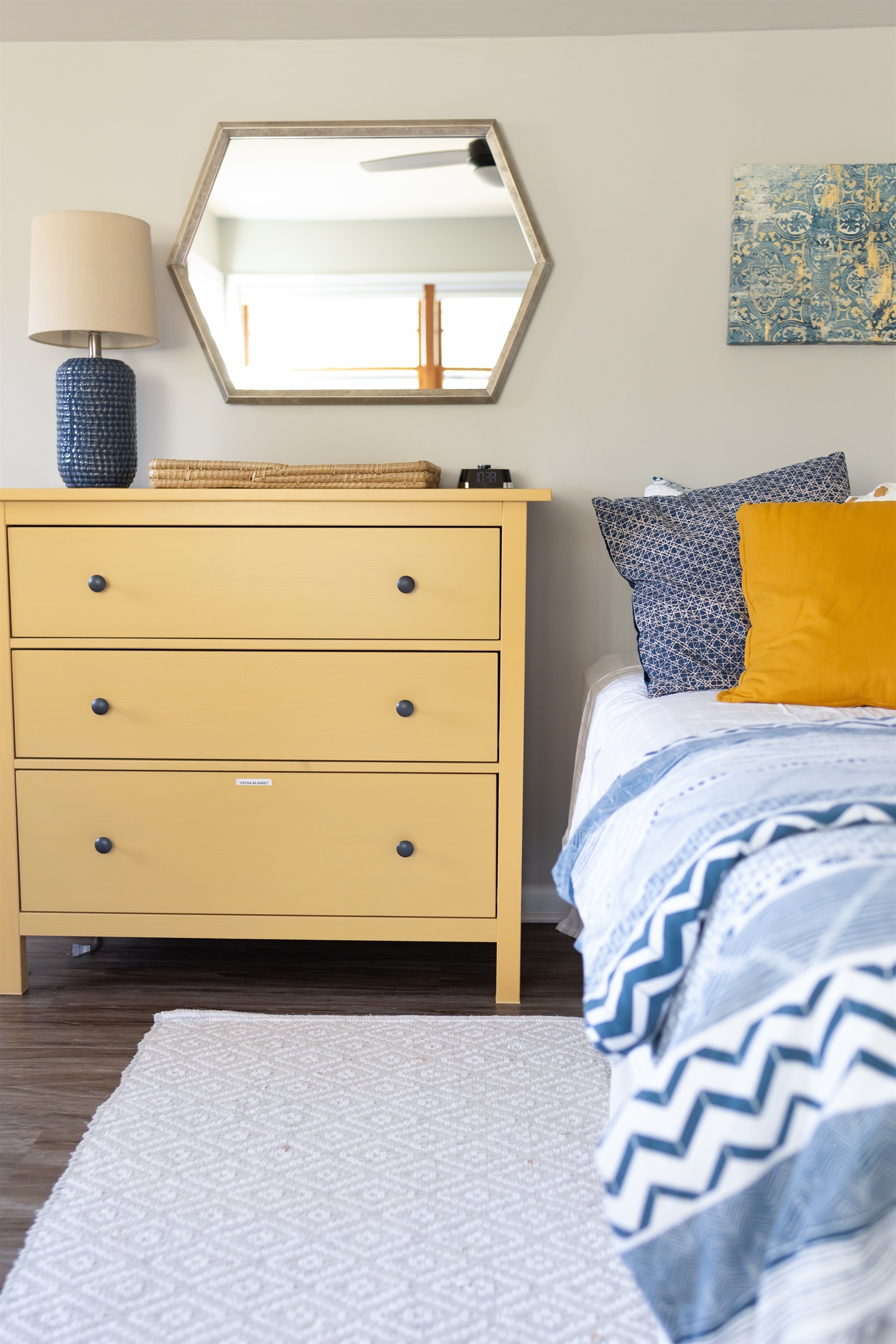 Full size dresser with extra blankets in bottom drawer