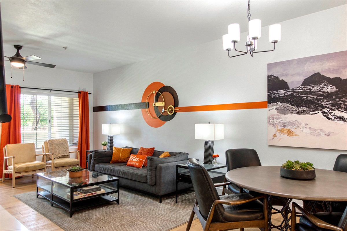 Spacious and stylish living room with high-speed WiFi, comfortable seating, and a smart TV — perfect for relaxing, streaming, remote work, or spending quality time with family and friends.