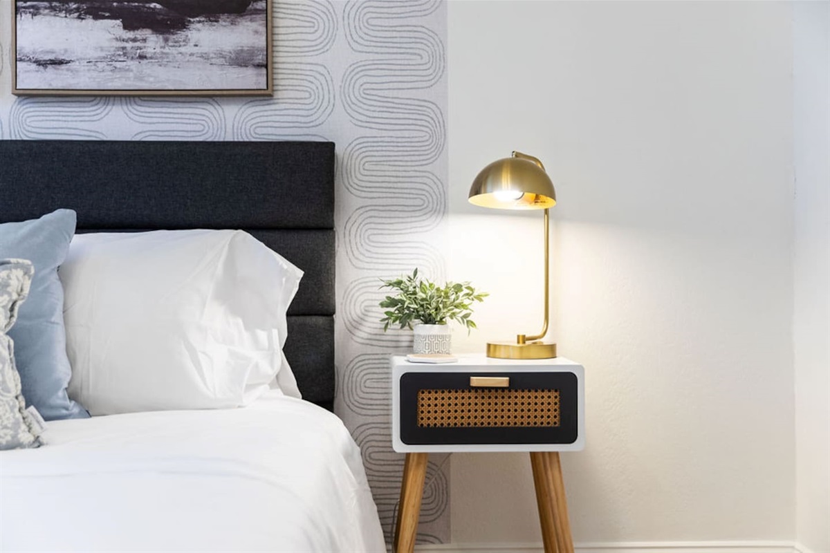 Bedside table with lamp.