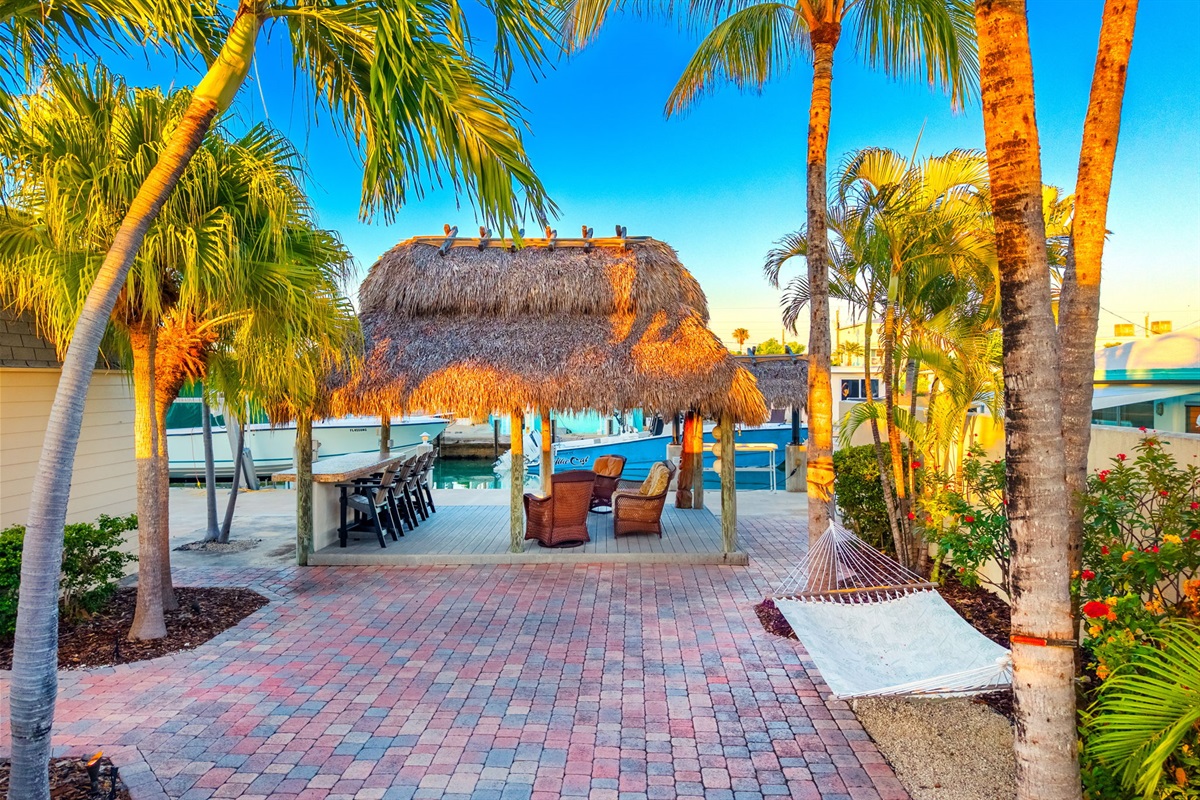 Head down towards the dock to enjoy the tiki bar and lounge.