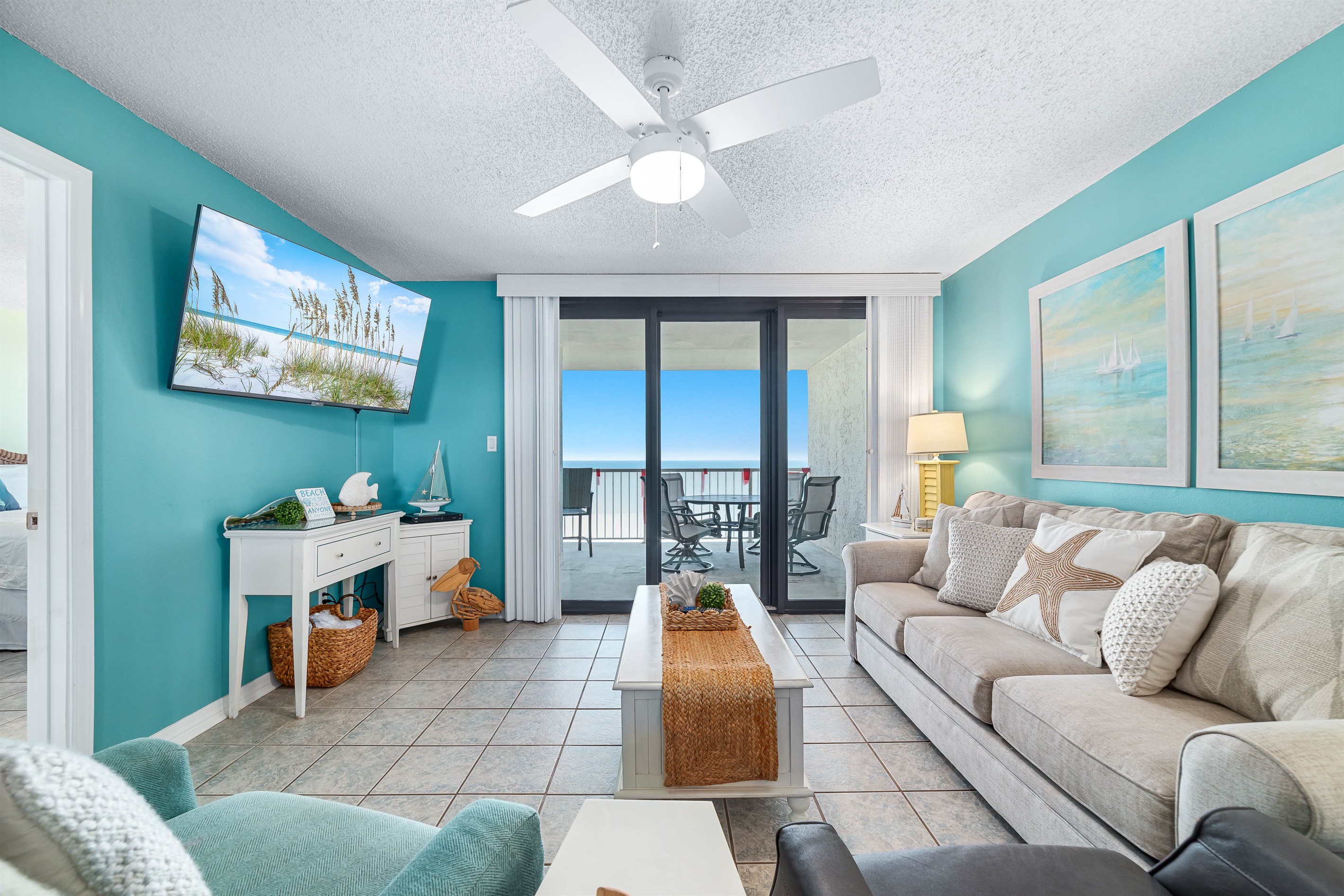 Enjoy your morning coffee with a breathtaking ocean view from the comfort of this living room, featuring a sleeper sofa for extra guests.