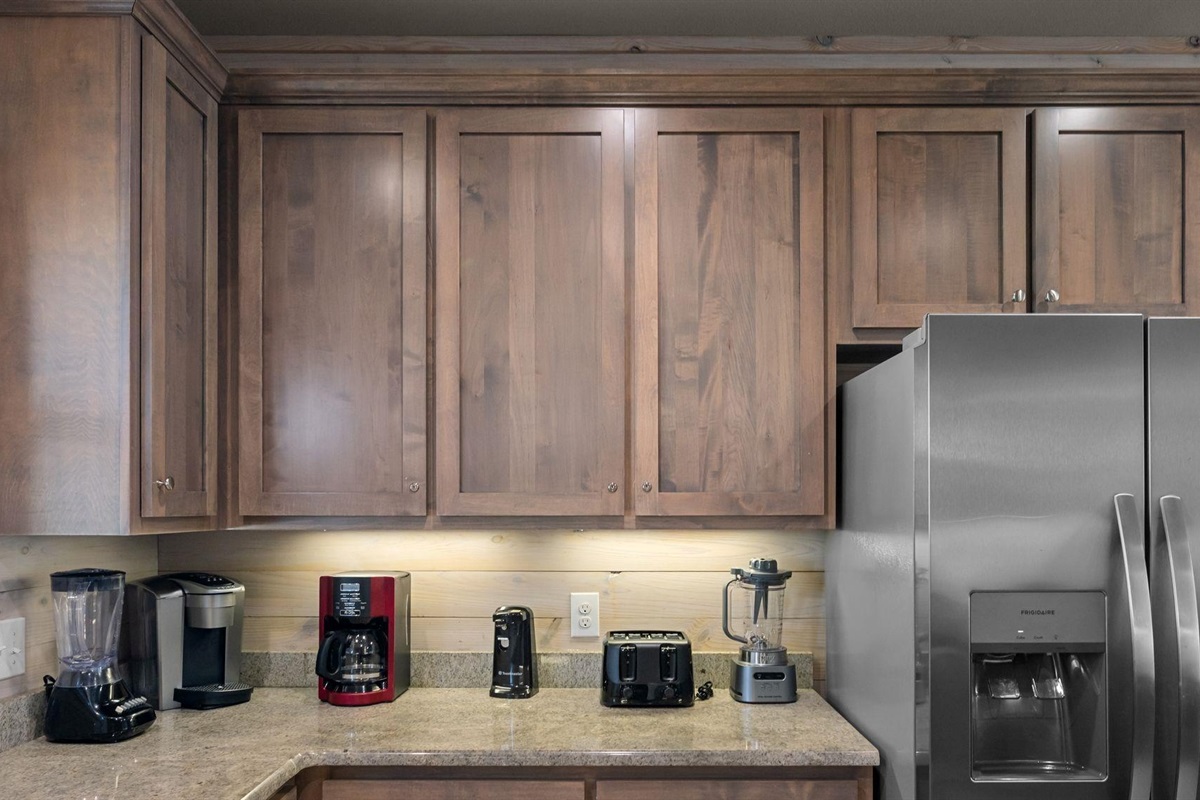 Fully stocked kitchen with stainless steel appliances, granite tops and beautiful view! 