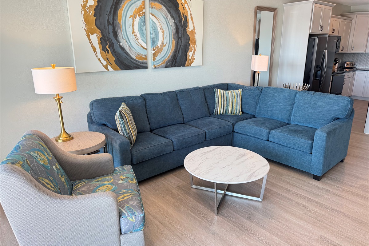 Large sectional and several chairs