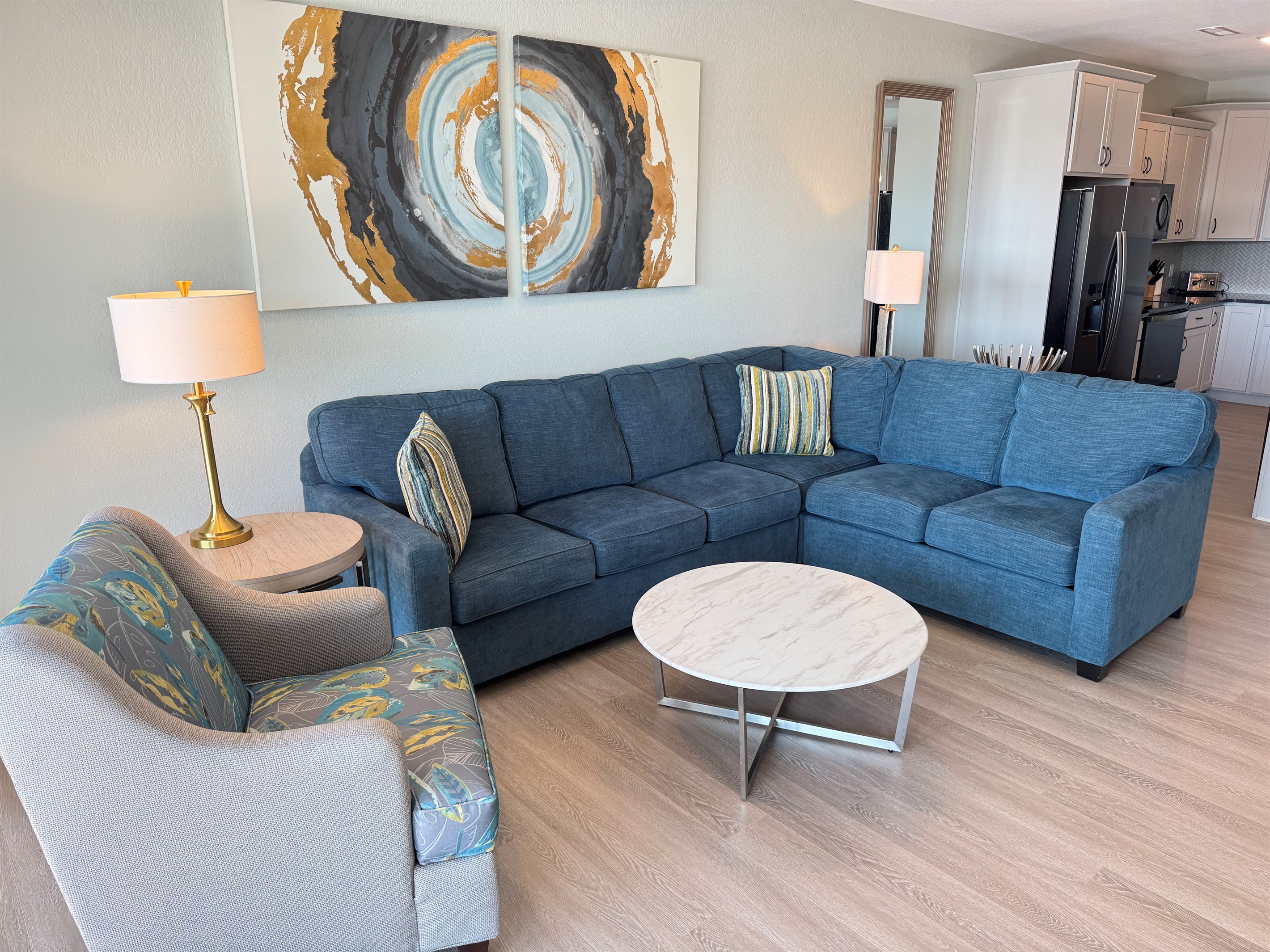 Large sectional and several chairs