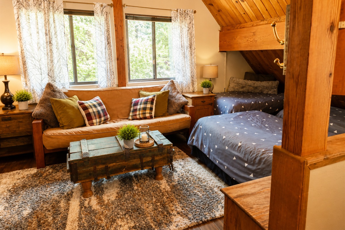 Our upstairs loft area is a great place for your group to spread out.  There are four beds and a seating area with tv, so it can be a second living spot as well as a sleeping area for a larger group.  It's a great place to let the kids hang out!