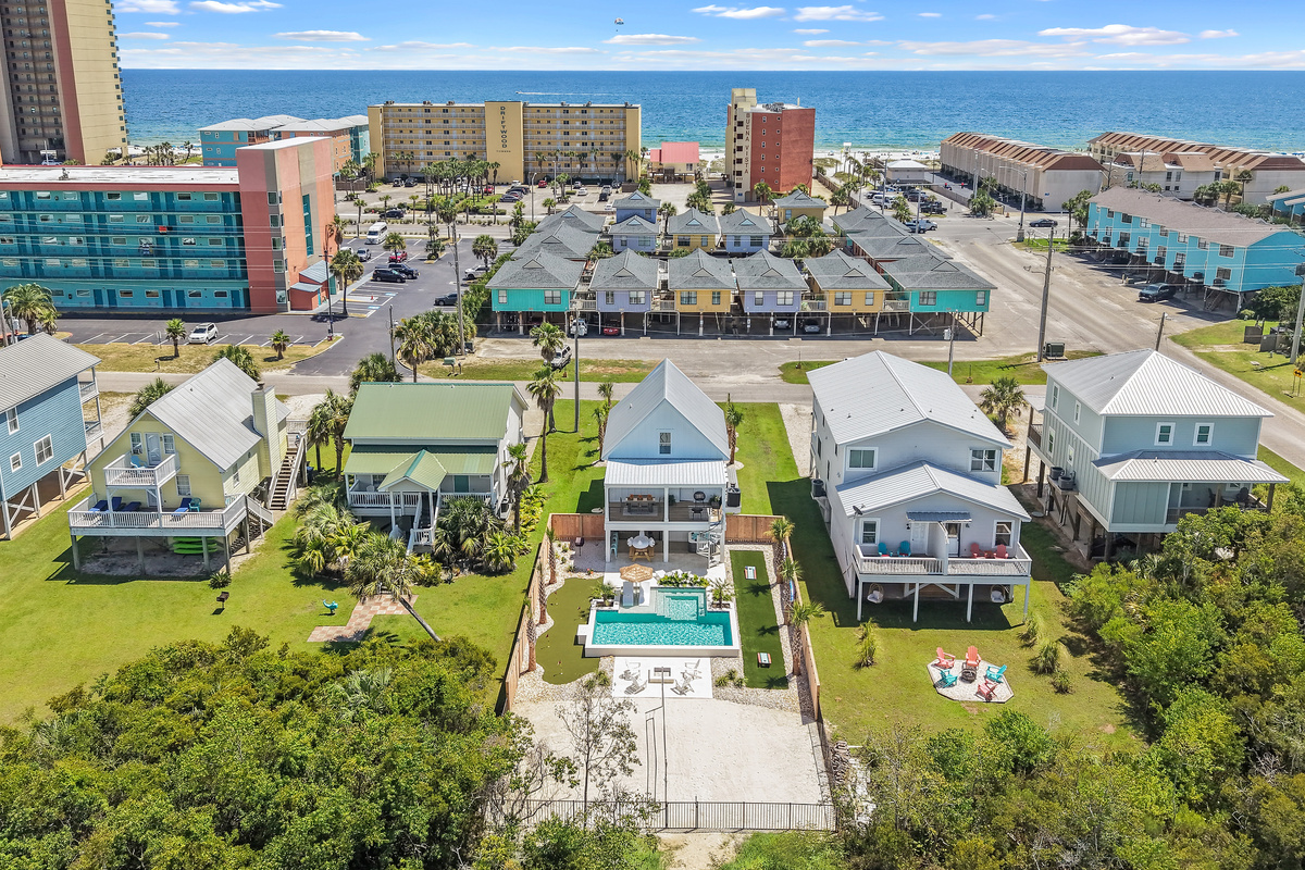Aerial perspective showing just how close the home sits to the Gulf shoreline.
