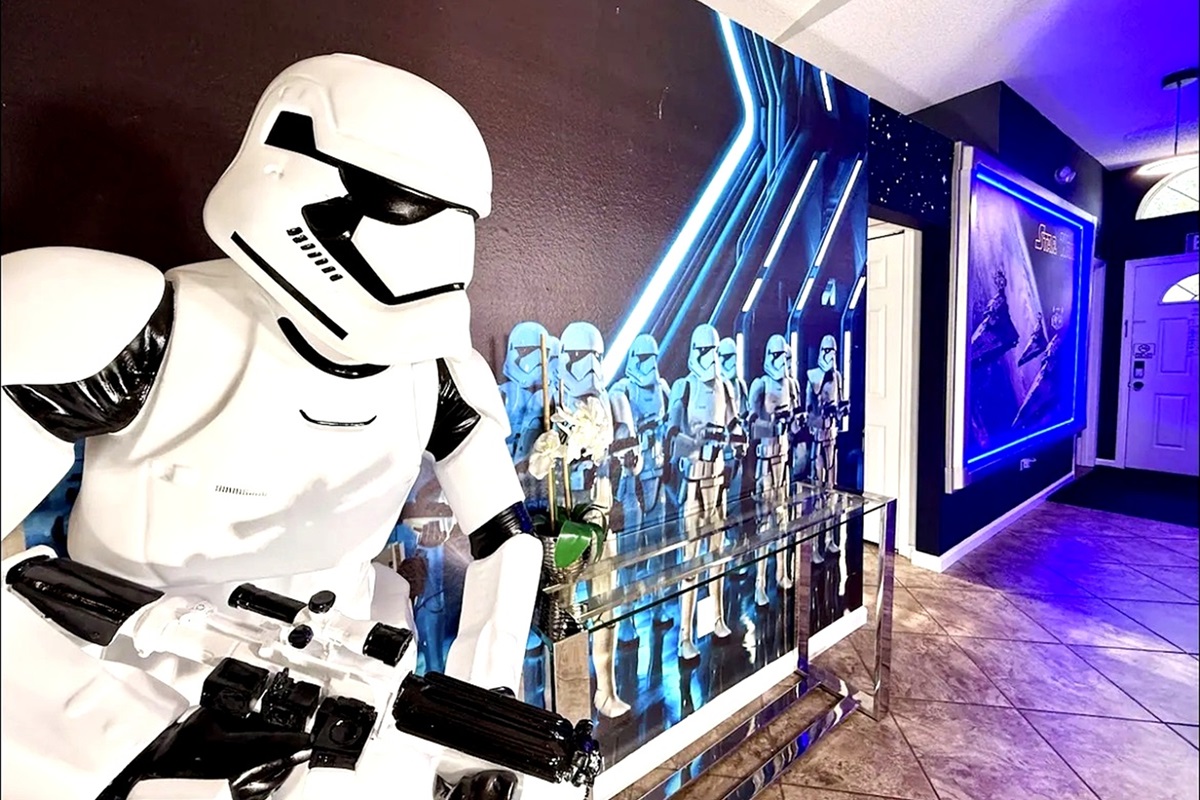 A modern hallway featuring a stormtrooper figure and themed wall art for a unique atmosphere.