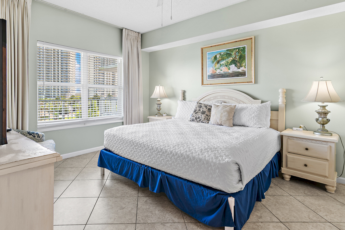 primary bedroom which features a King Bed, new furniture, Smart TV, large closet, and private bathroom with dual vanity