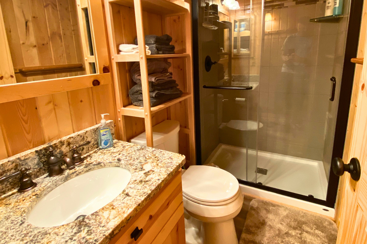 Beautifully renovated bathroom features a walk-in shower.