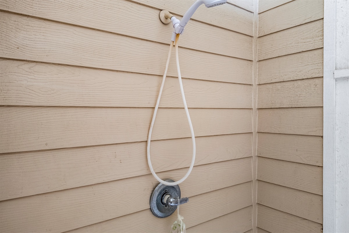 “Outdoor shower — rinse off the beach salt.”