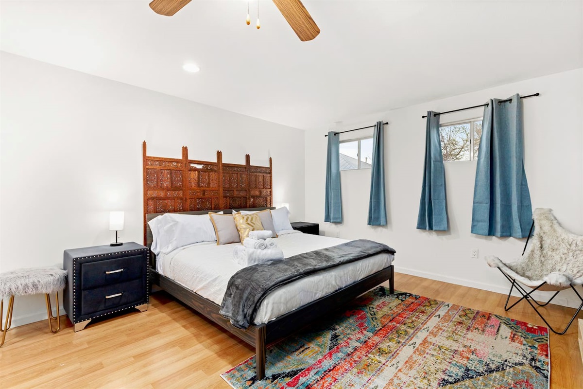 Step into this bright, airy bedroom that promises a restful night's sleep in a private space that feels both spacious and intimate.