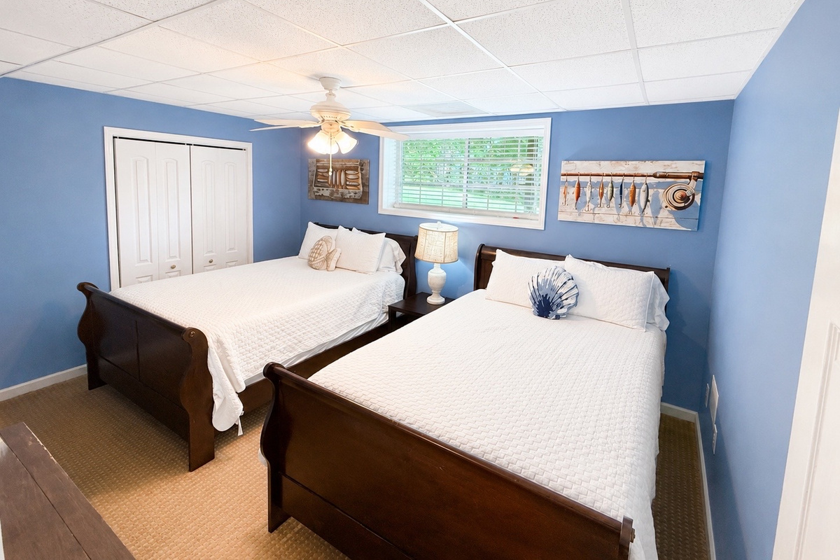 Spacious basement bedroom with comfortable bedding