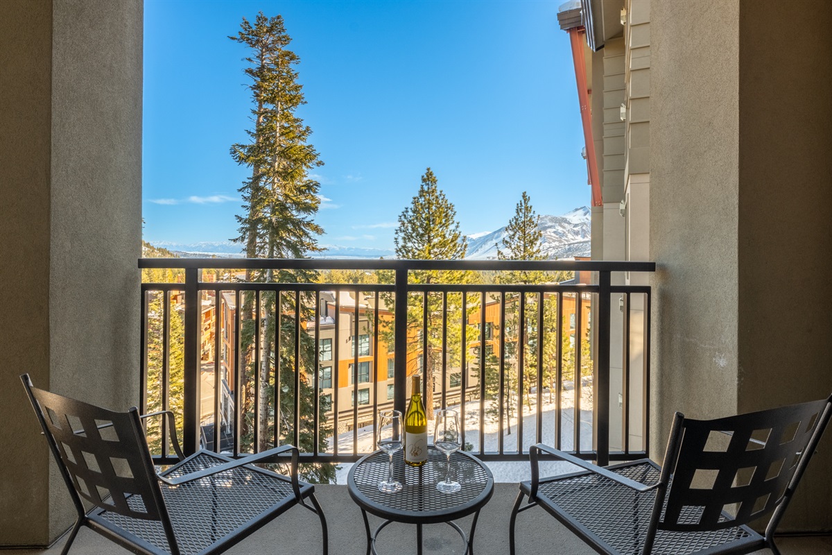 The east-facing balcony is perfect for morning coffee at sunrise or an afternoon glass of wine, with cozy chairs and table made for lingering.