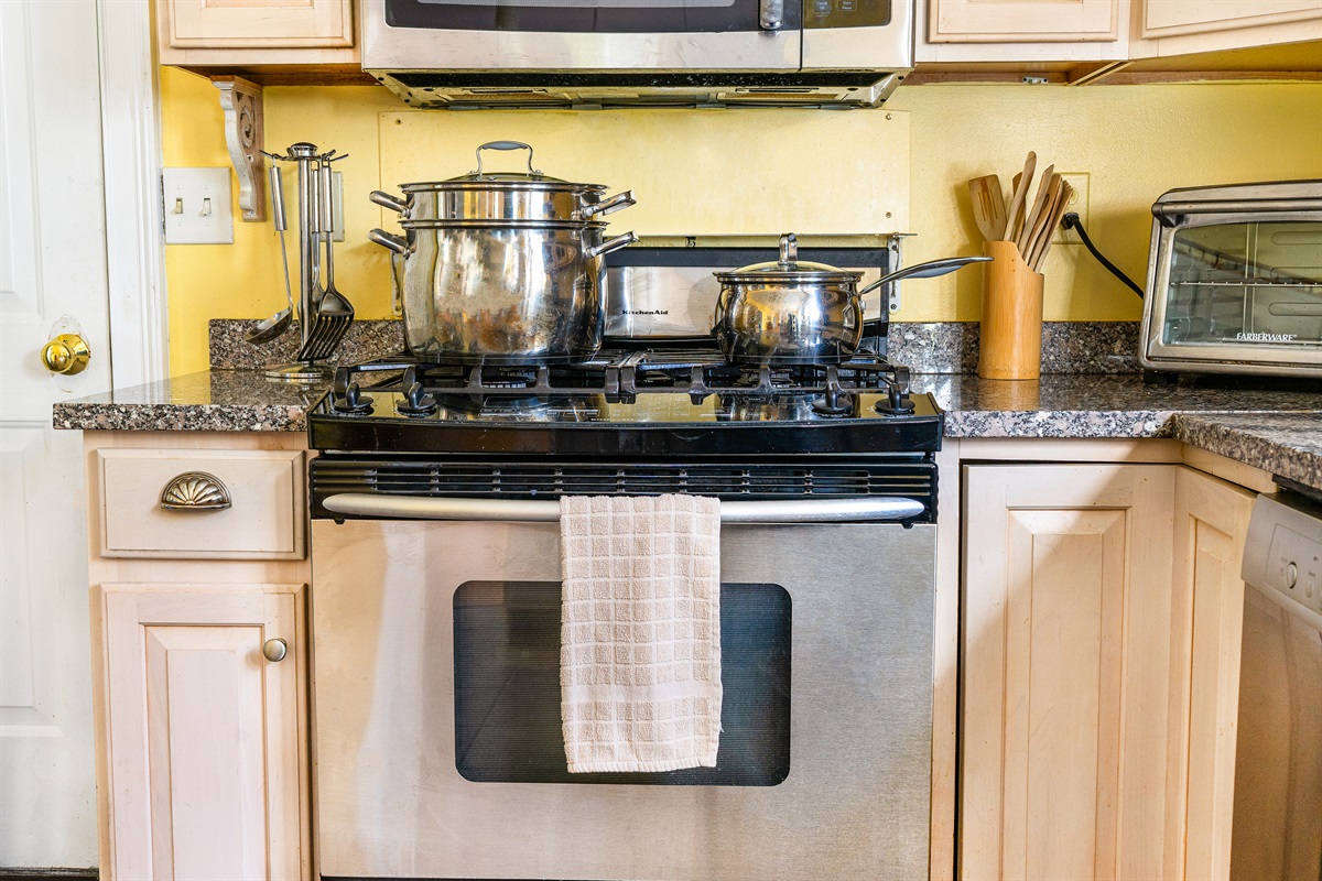 Prepare your Acadia feast using a professional KitchenAid gas range and large lobster pot. The door leads to the garage for easy grocery unloading, making meal prep a breeze for your Southwest Harbor group getaway.