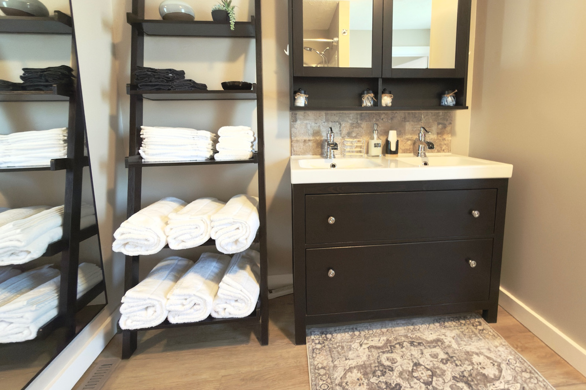 Primary bathroom combination tub and shower with provided toiletries.