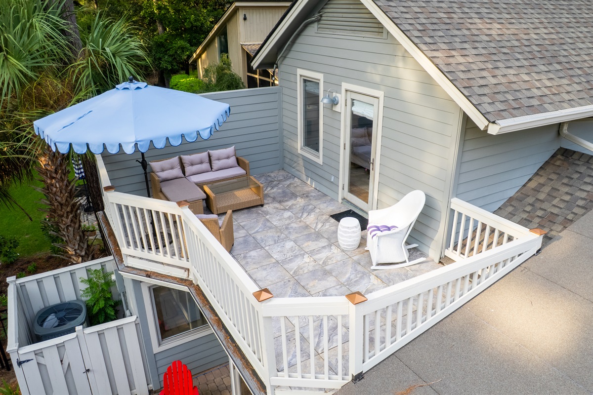 Private deck off upstairs queen bedroom overlooking pool and spa