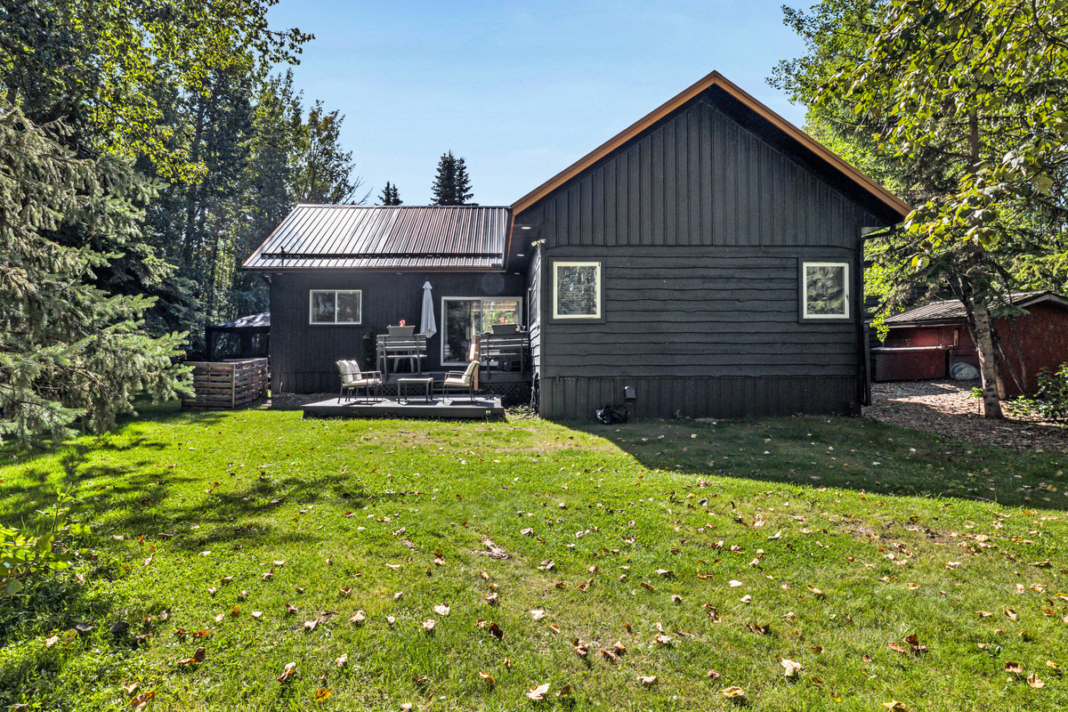 Aspen Acre sits comfortably among the trees, with a large backyard and outdoor spaces designed for relaxing together.