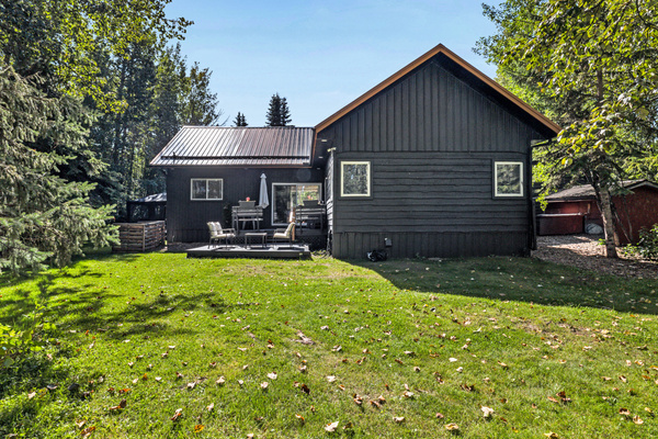 Aspen Acre sits comfortably among the trees, with a large backyard and outdoor spaces designed for relaxing together.