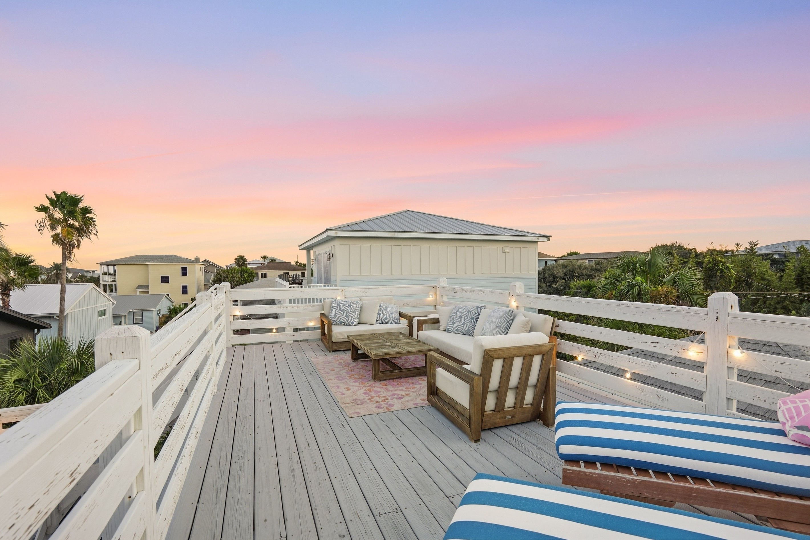 This photo gives you a great sense of the outdoor deck and backyard space. While cozy, it’s thoughtfully layered to create intimate spots for dining, chatting, or relaxing. Even with a large crowd, everyone can find their own little nook to enjoy!