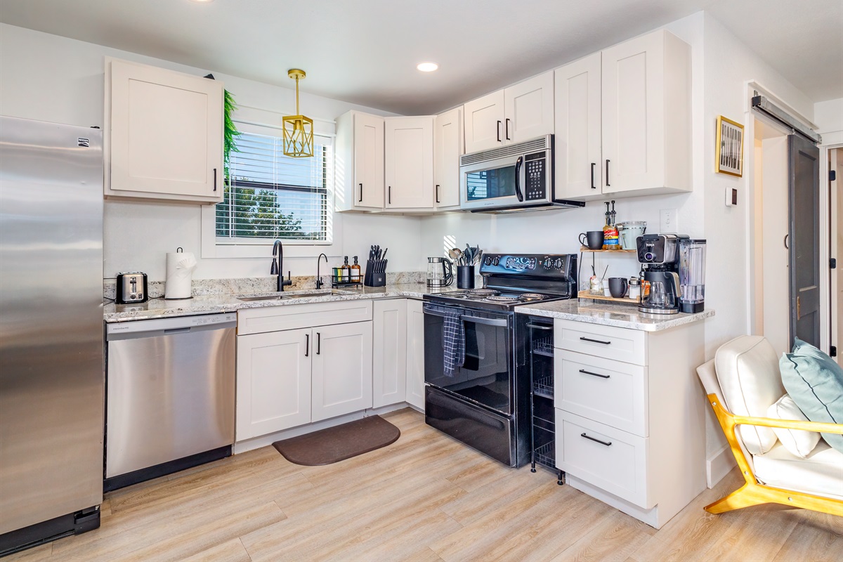 Fully stocked kitchen with everything you need&mdash;full-size fridge, stove, microwave, dishwasher, and a coffee bar for your morning brew.