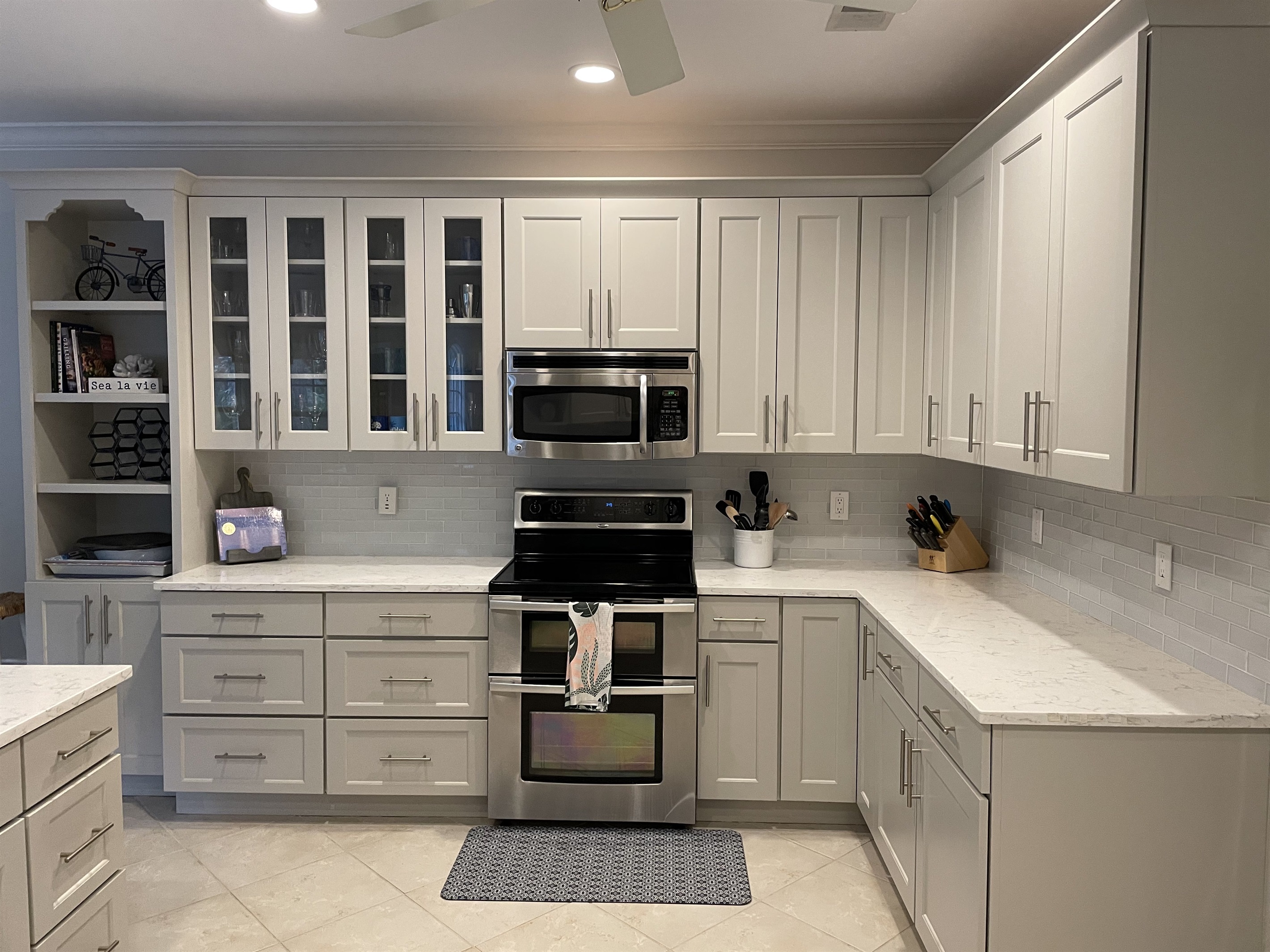 Well-stocked kitchen with plenty of counter space, microwave and double oven