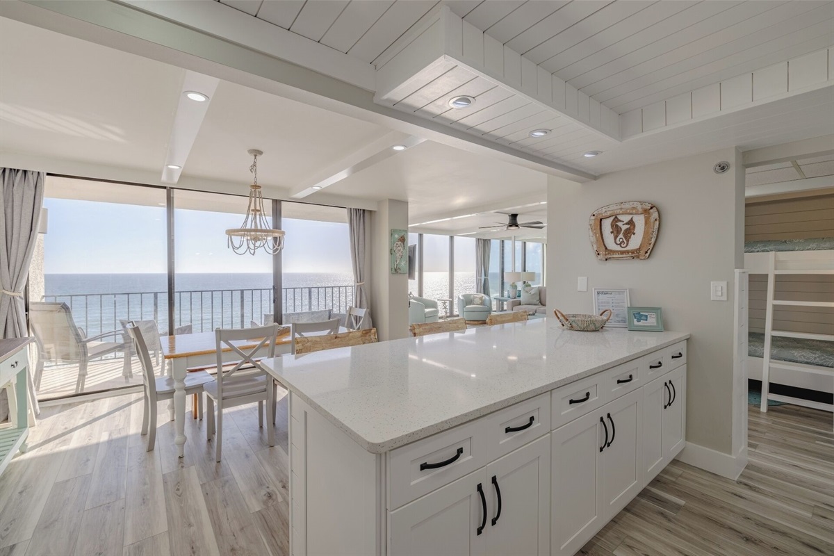 Large bar area overlooking dining table and water view