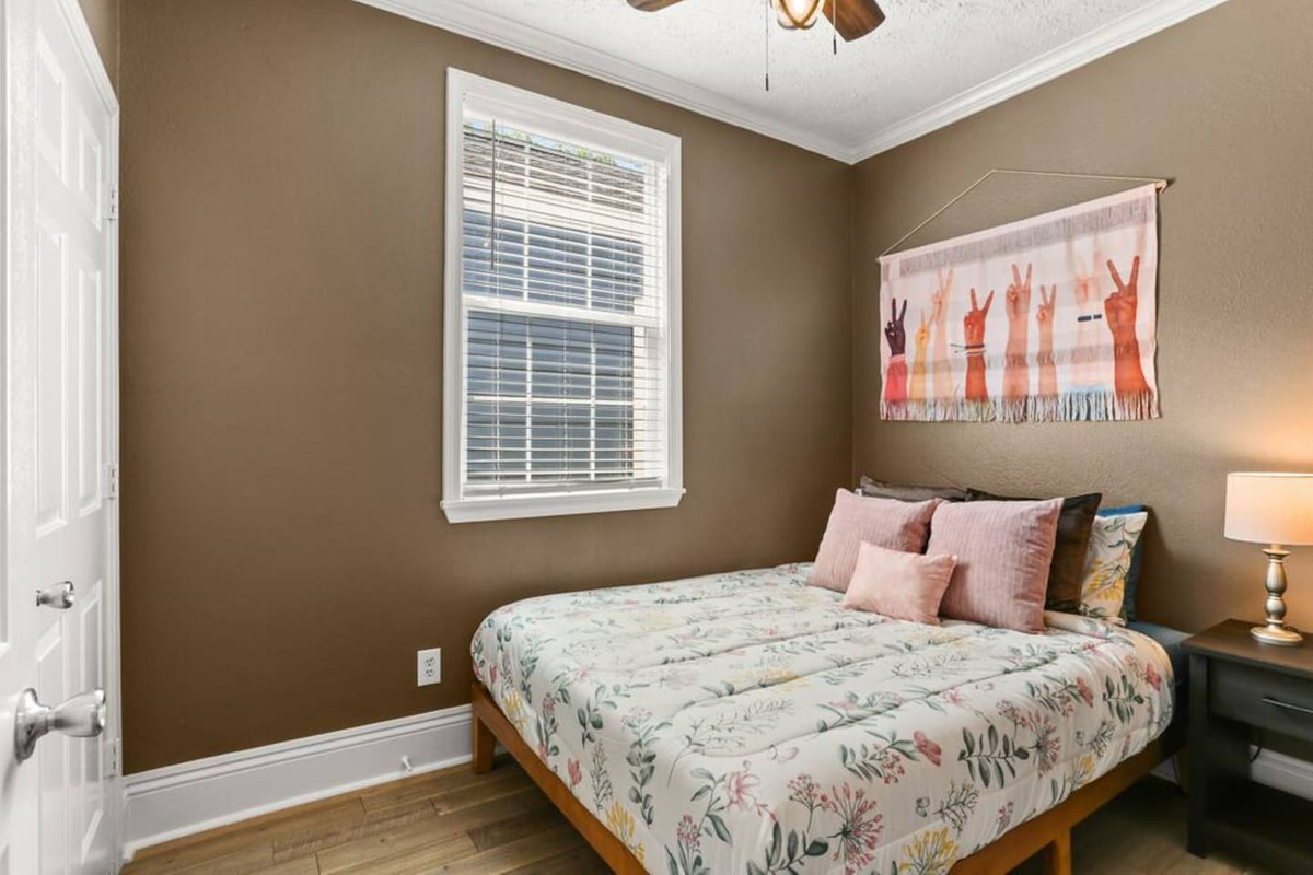 The "Brown" bedroom has a comfy queen bed, closet, plenty of pillows, and everything for a restful stay
