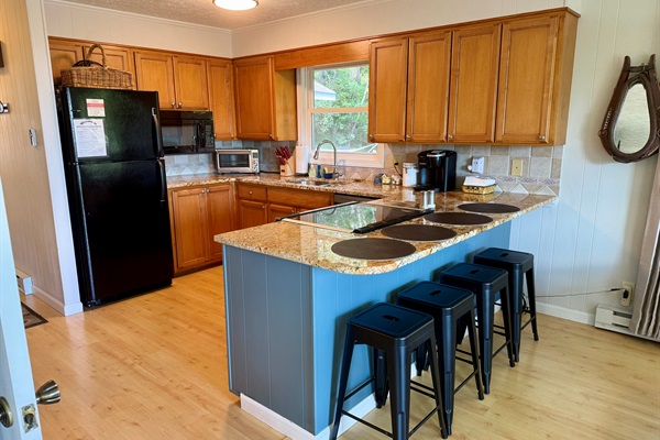 Our kitchen is stocked & we've cooked Thanksgiving for 10 here! Enjoy views, large pantry, stainless range & dishwasher, double sinks, fridge, microwave, lots of bakeware & serving pieces.