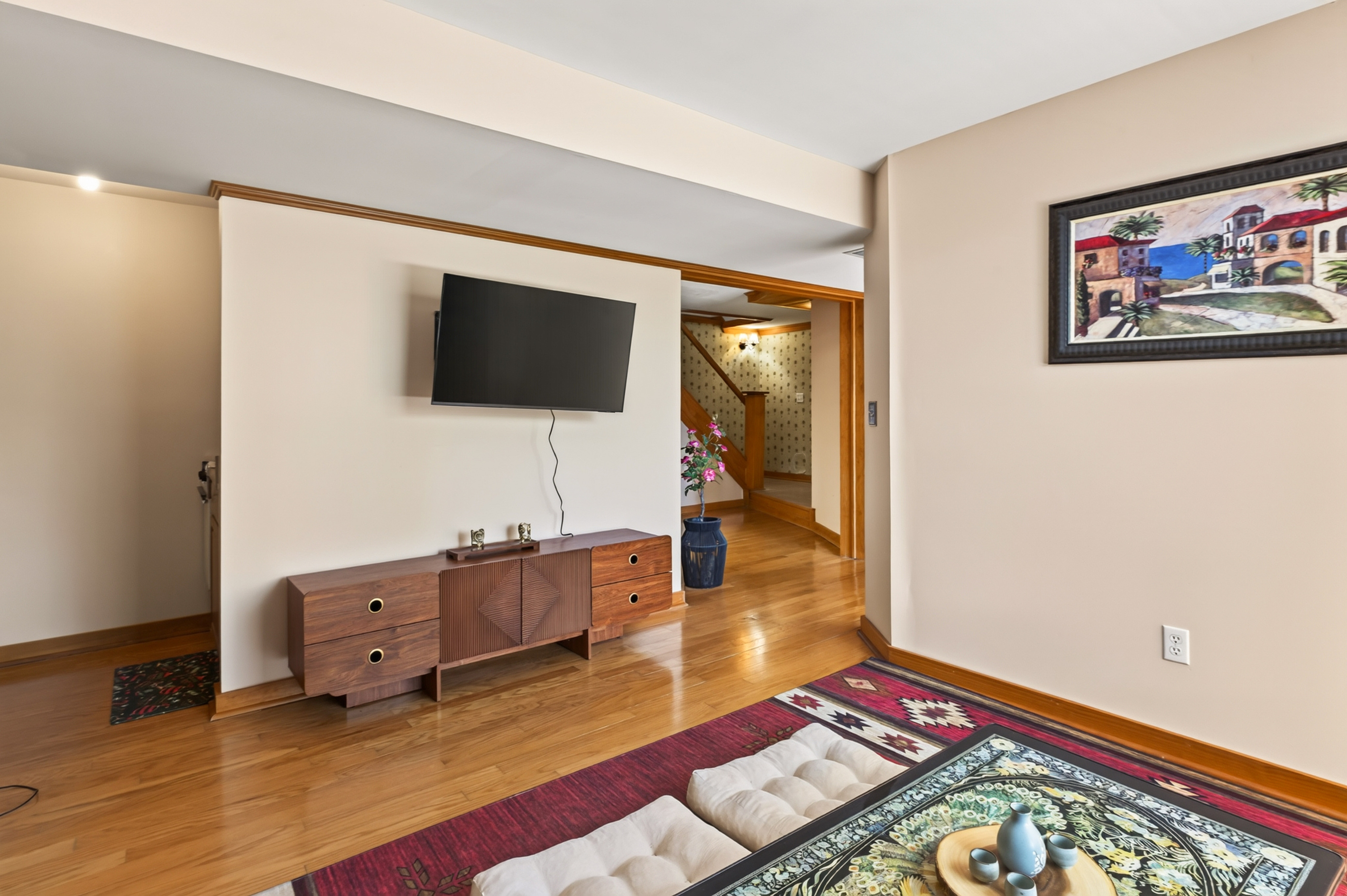 Sitting room with wall-mounted television