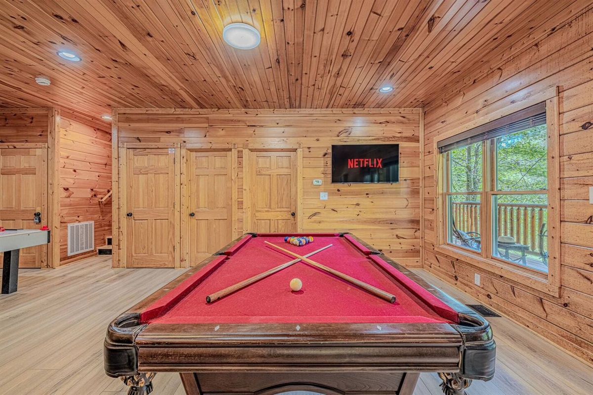 Full-size pool table in the lower-level game room. The Crown Jewel &mdash; 5BR luxury group cabin in Gatlinburg, TN with private game room and theater.