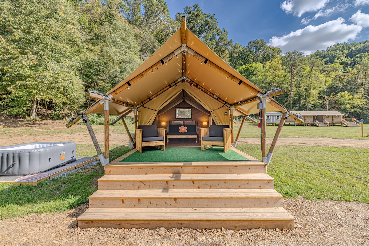 Welcome to Capricorn! Your home away from home. Step up to your luxury tent, where a queen bed awaits behind a spacious deck perfect for morning coffee and enjoying the sounds of nature.