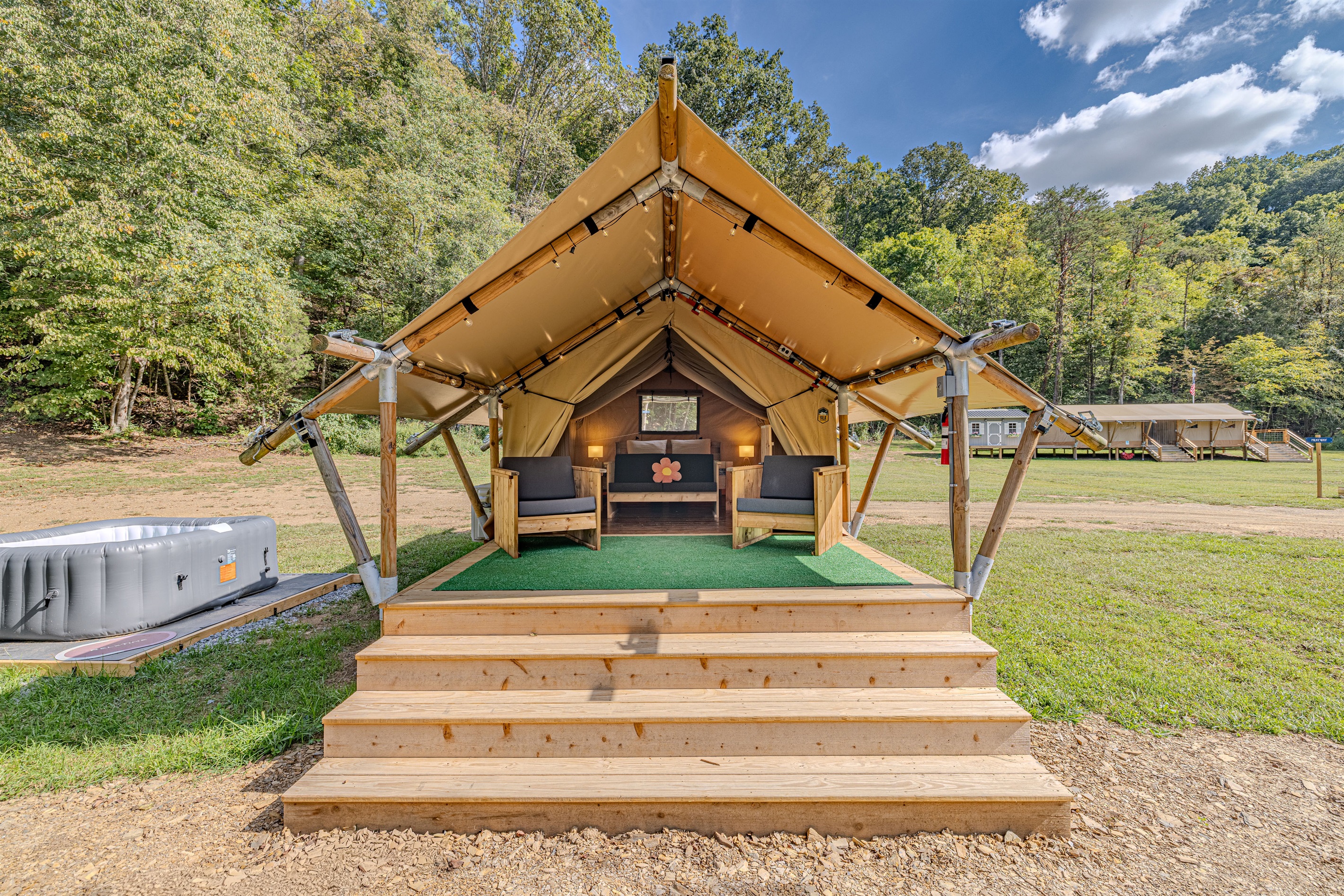 Welcome to Capricorn! Your home away from home. Step up to your luxury tent, where a queen bed awaits behind a spacious deck perfect for morning coffee and enjoying the sounds of nature.