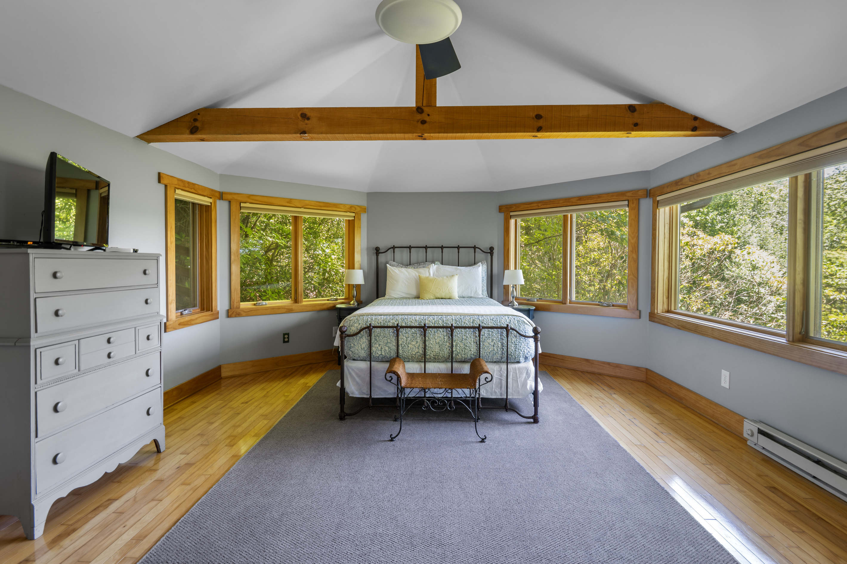 Primary bedroom with natural light and gorgeous views