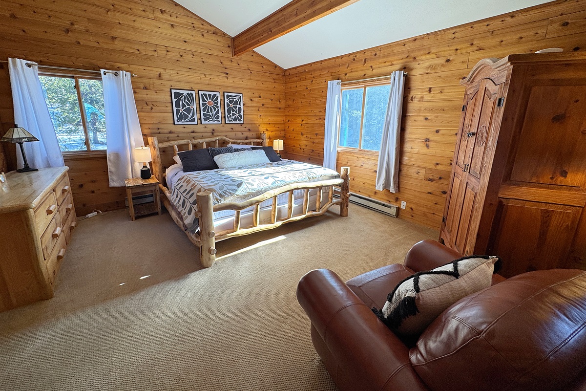 Oversized Primary Bedroom with King bed, tv and seating