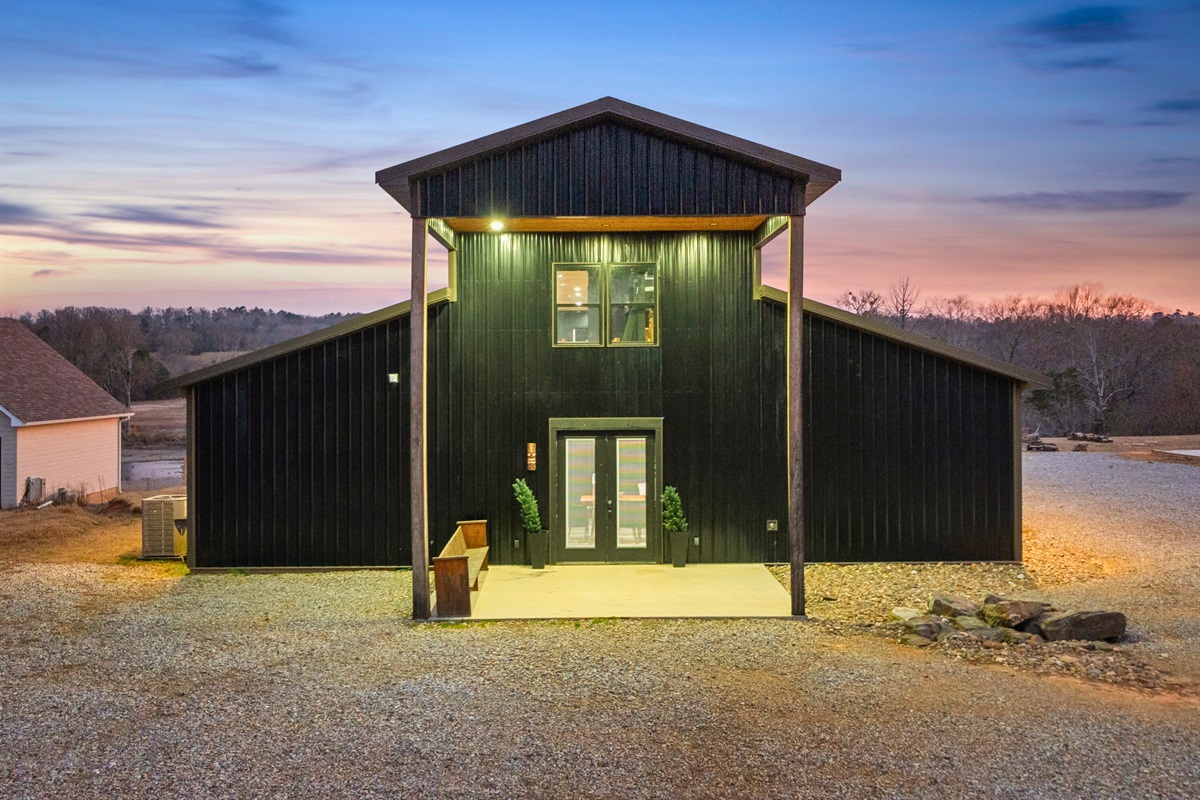 The front entrance stands tall and inviting, offering a dramatic architectural statement.