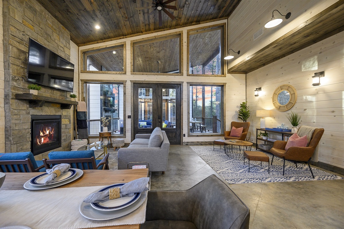 Gather for dinner by the fire, where open spaces and cozy details set the tone for unforgettable evenings.