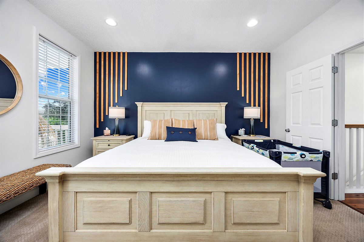 [MasterBedroom] Sink into a plush king bed with premium linens, ensuite spa bath, and balcony access &mdash; unwind while the kids dream down the hall.