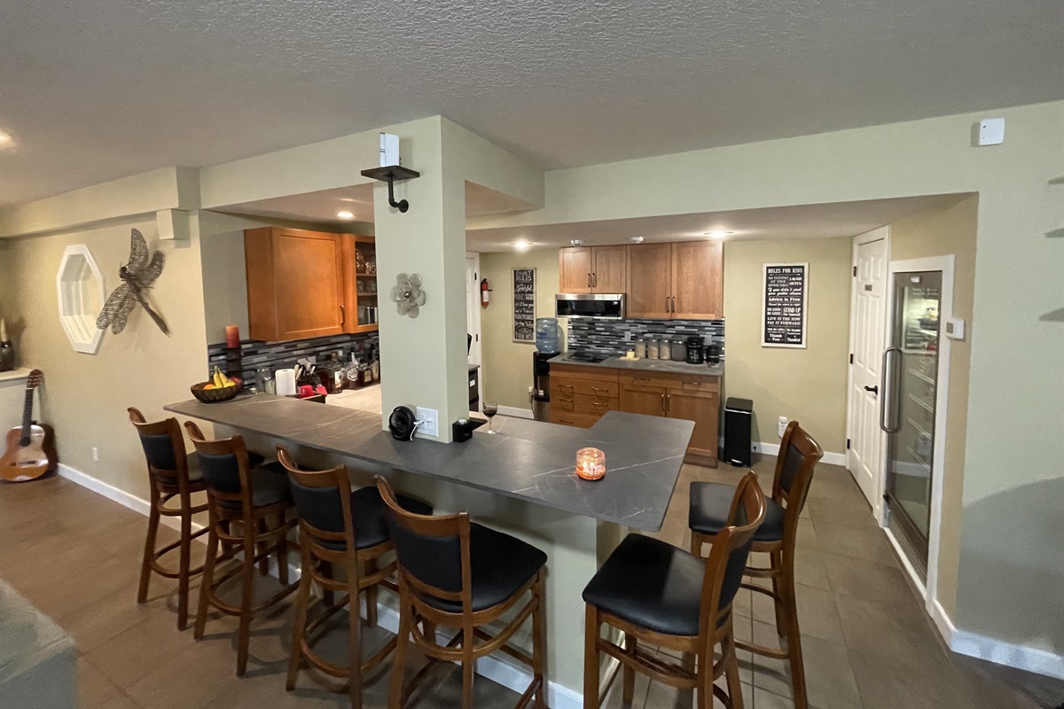 Kitchen & wet bar, and seating for 6.