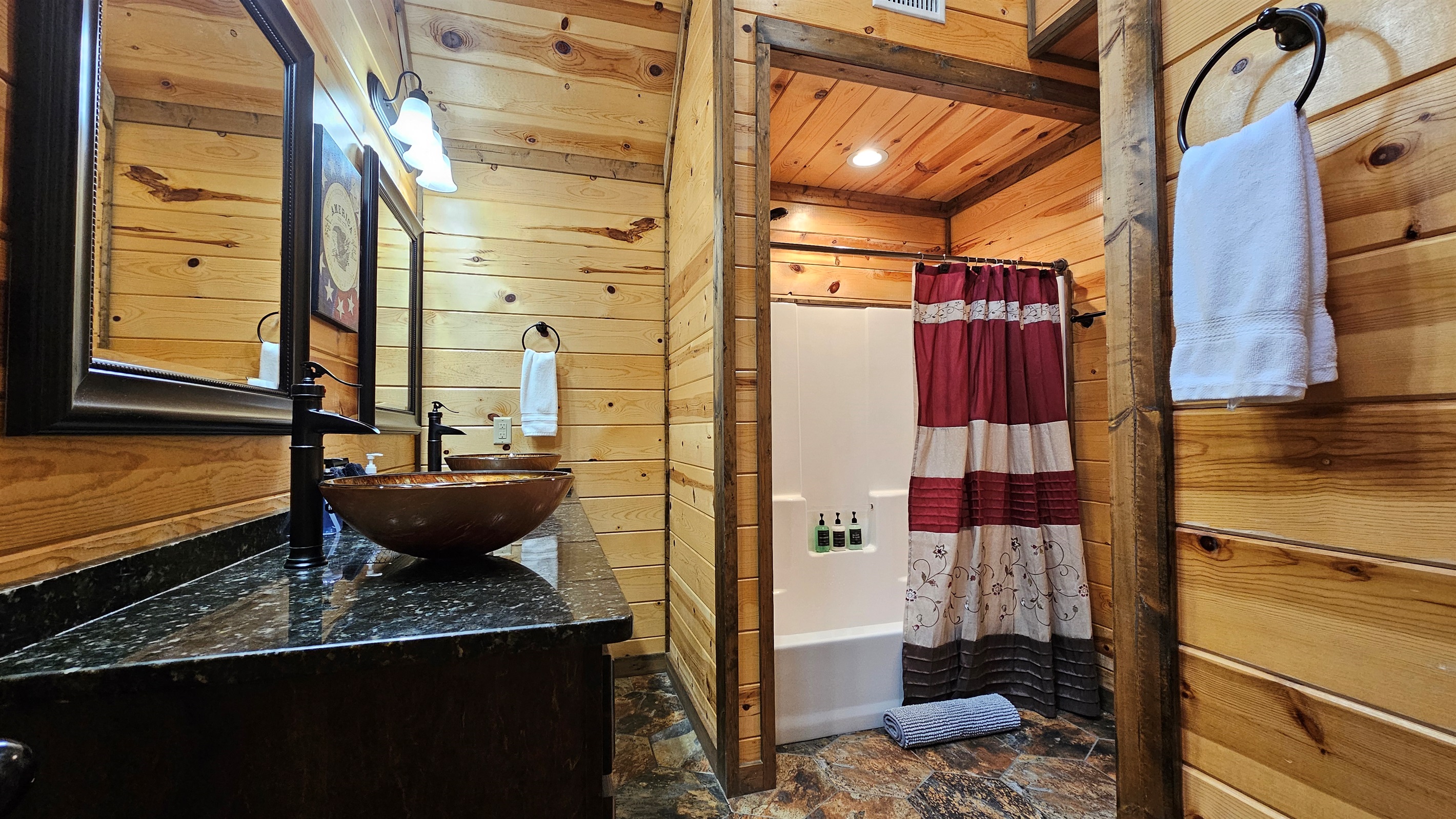 Bathroom Oasis: Natural wood accents and stylish fixtures create a rejuvenating retreat!