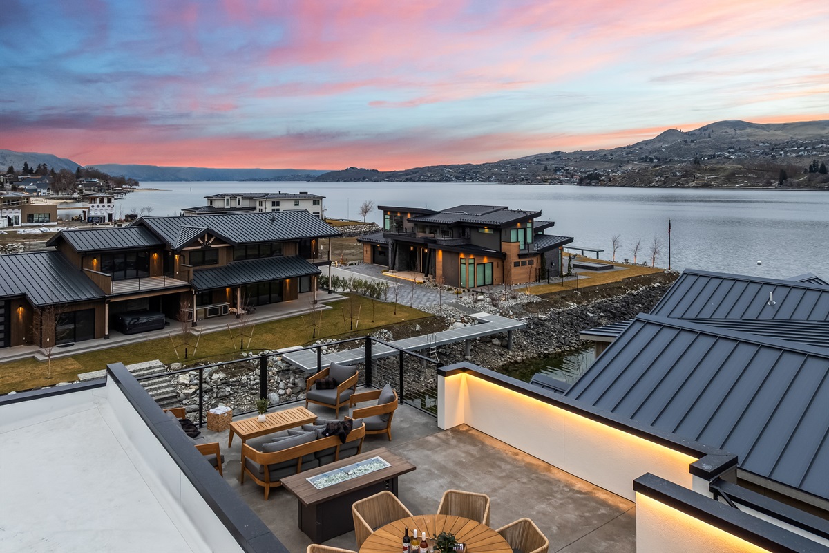 Roof top deck with lounge seating, fire table and dining table