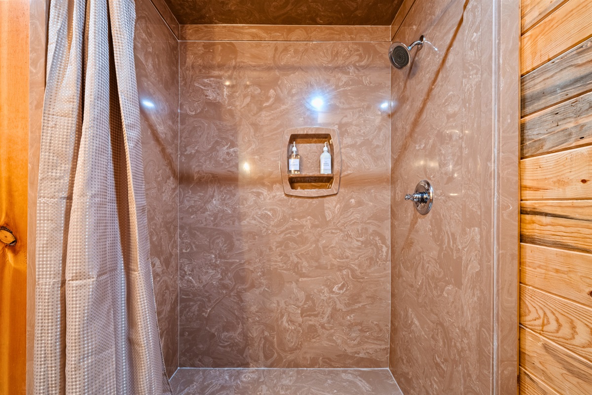 Clean and comfortable, the shower setup makes it easy to rinse off after hiking, swimming, or exploring nearby trails.
