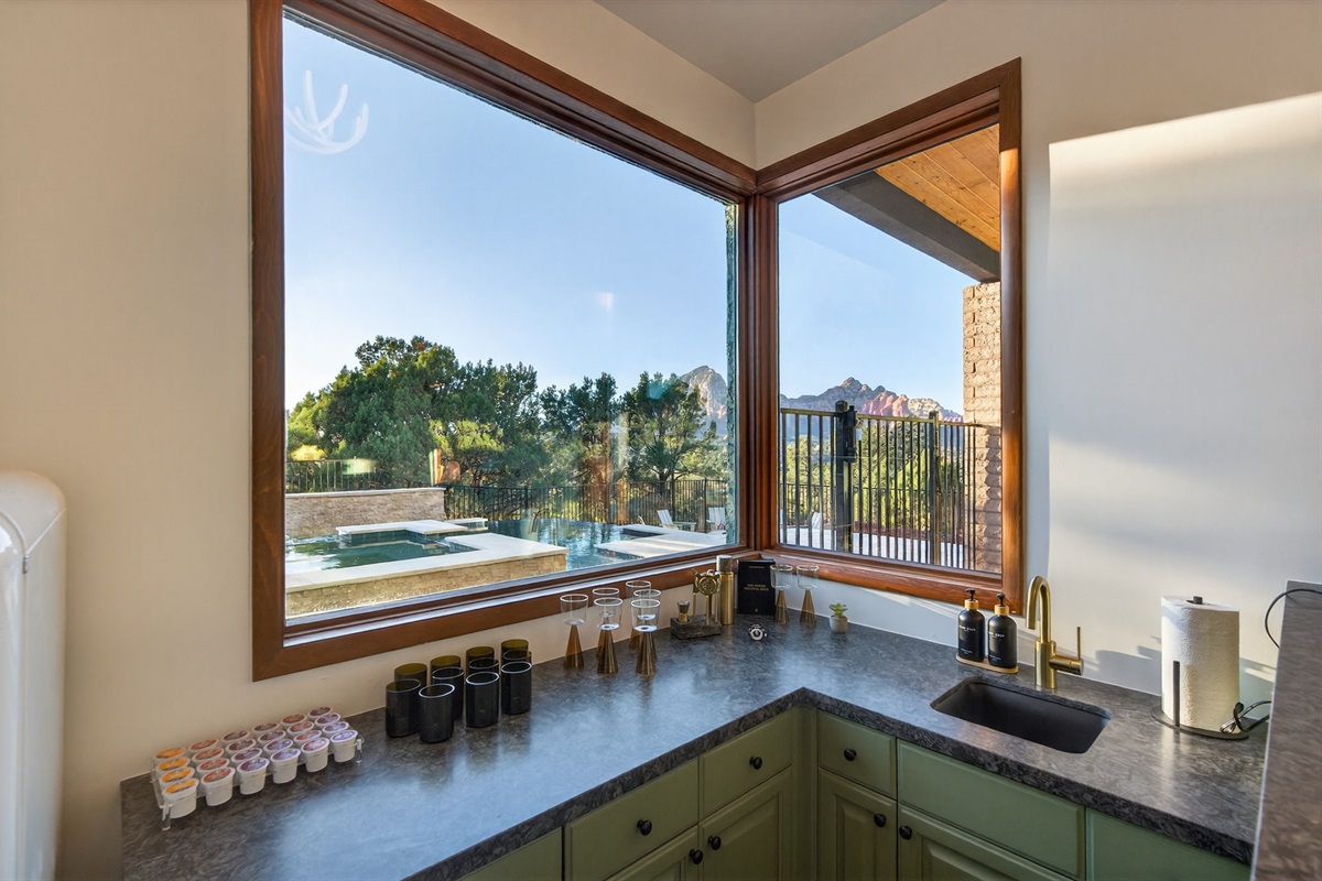 Elevated bar experience—sip and unwind with stunning Sedona views just outside your window.